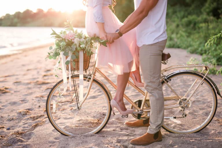 Romantic Sunset Beach Engagement Featuring Florals & Bicycle